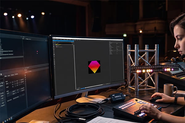 An engineer programming a DMX512 lighting system